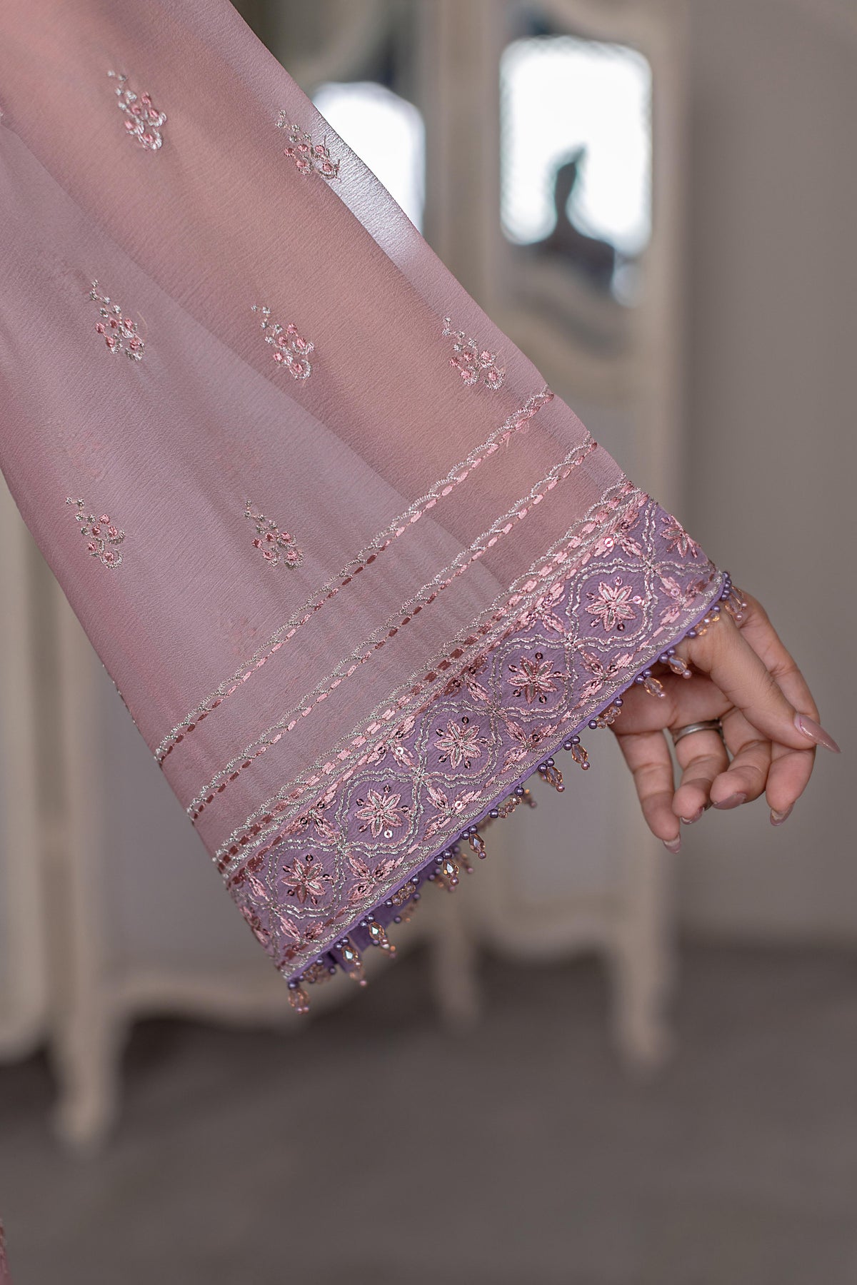 Roselle – Close-up of Floral Embroidery Detail on Dusty Pink Chiffon Sleeve with Purple Border | Flossie